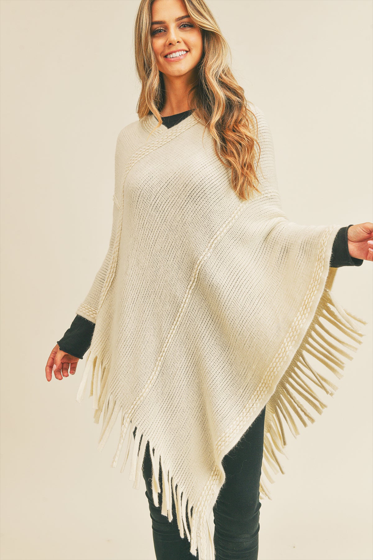 EMBOSSED DOTTED LINE TASSEL PONCHO