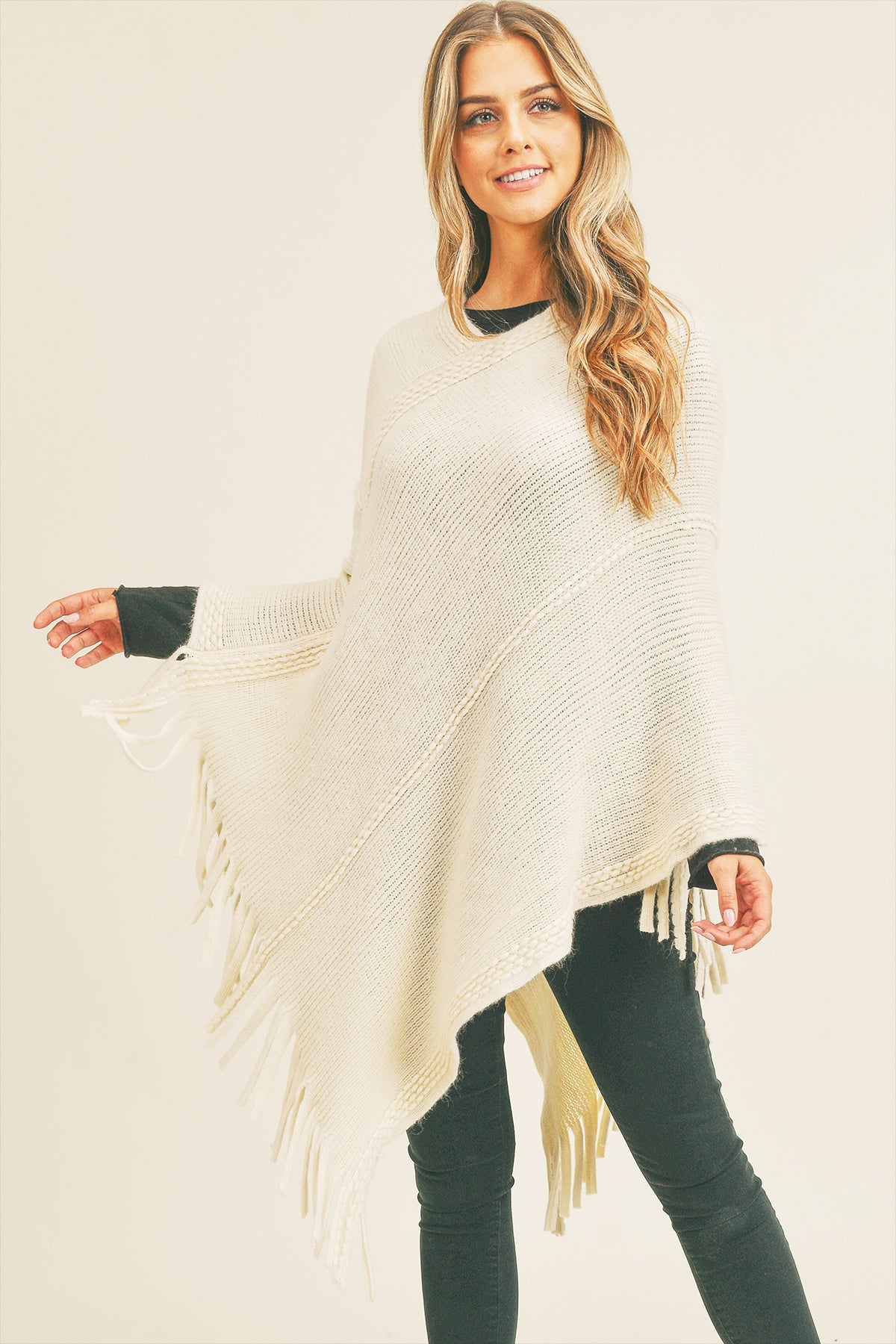 EMBOSSED DOTTED LINE TASSEL PONCHO