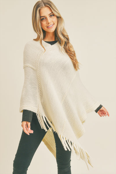 EMBOSSED DOTTED LINE TASSEL PONCHO