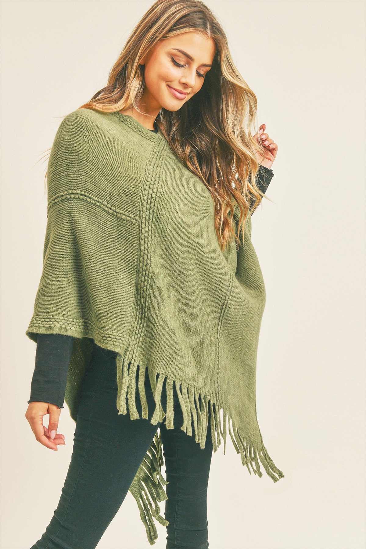 EMBOSSED DOTTED LINE TASSEL PONCHO