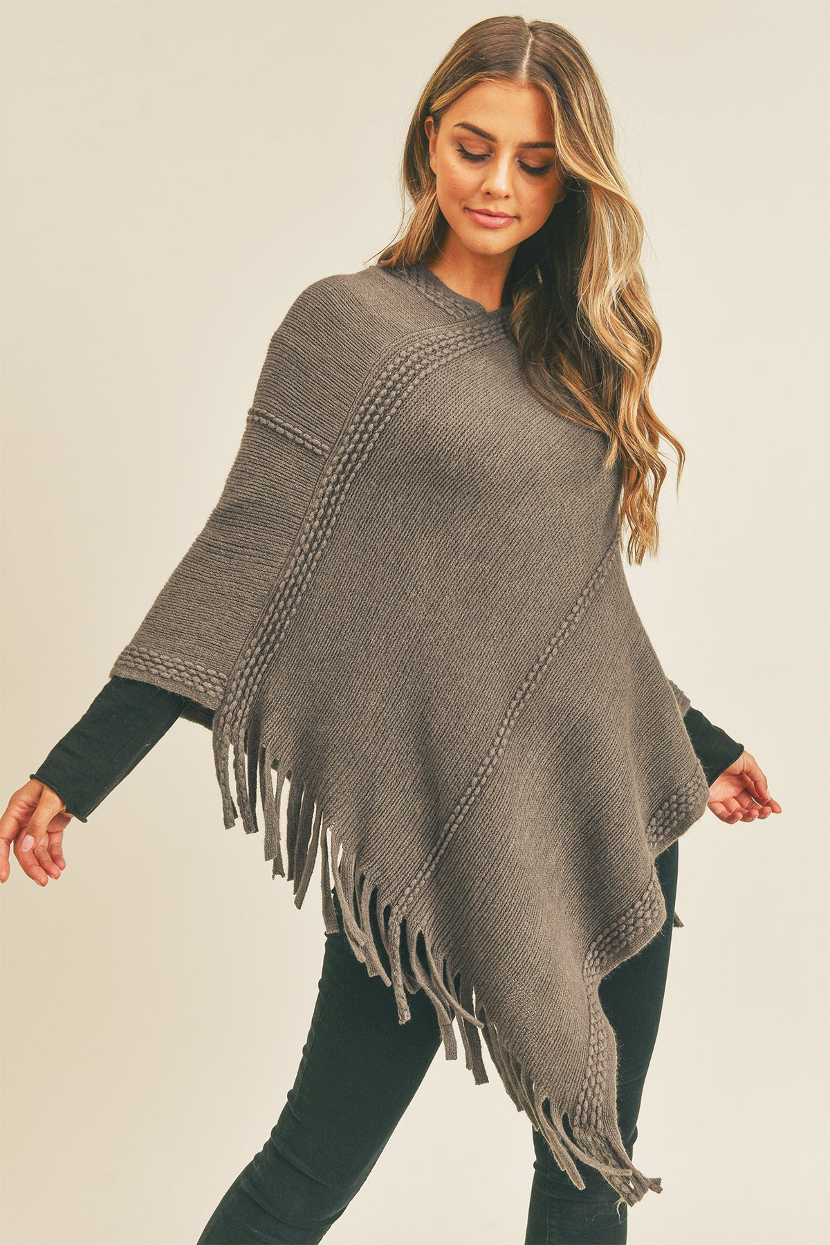 EMBOSSED DOTTED LINE TASSEL PONCHO